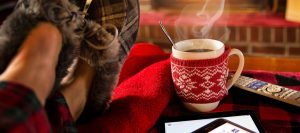 Resting at a lit Chimney with feet up enjoying a coffee and putting down the phone and tablet while the Mortgage agent does a great Job getting the Mortgage approved